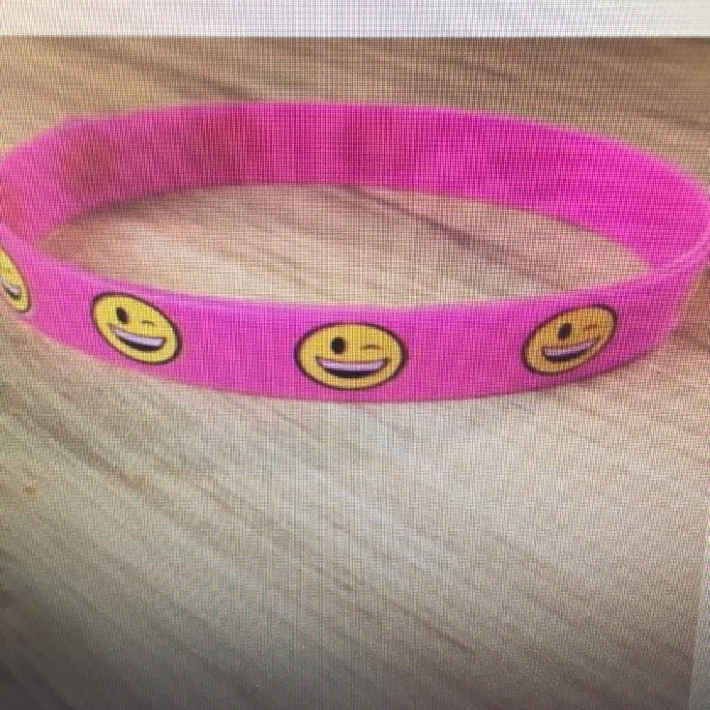 Pink rubber bracelet 😊 smiley faces